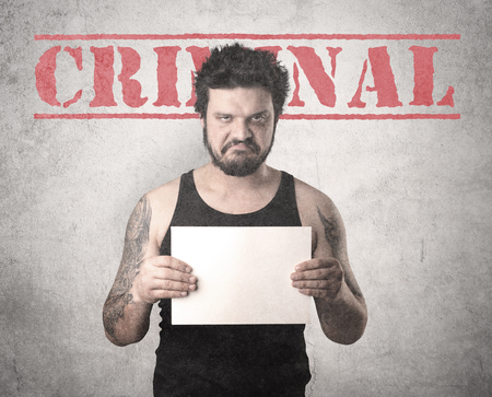 Caught gangster with criminal background.の写真素材