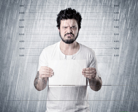 Gangster with rainy, lowering background and table on his hand.の写真素材