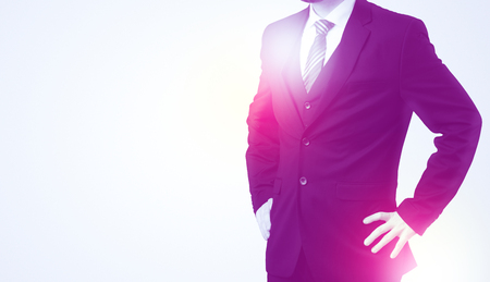 Young businessman standing and thinking without headの写真素材