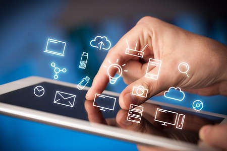 Female hands touching tablet with white technology related icons