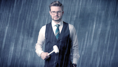 Young handsome  man holding tool with raindrop graphicの写真素材