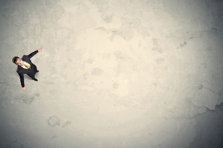 Business man from top standing with copy space desert backgroundの写真素材