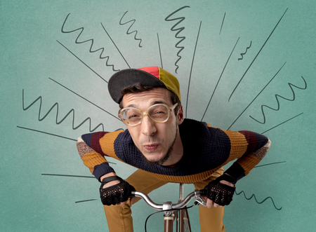 Extreme young cyclist with doodle on the backgroundの写真素材