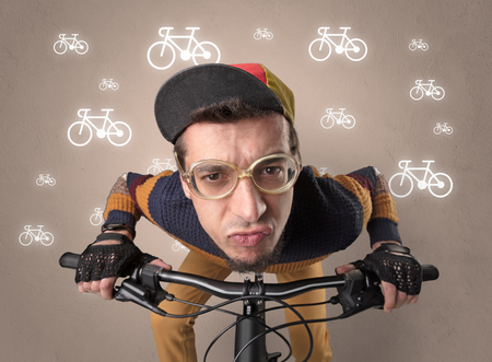 Young ridiculous biker with line drawn bikes on the backgroundの写真素材