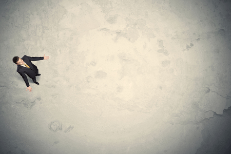 Business man from top standing with copy space desert backgroundの写真素材