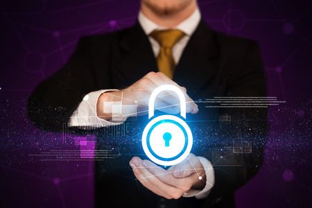 Businessman with security concept in his handsの写真素材