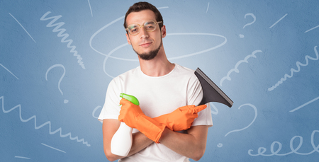 Swabber with orange rubber gloves and doodle concept on wallpaperの写真素材