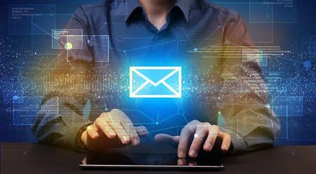 Businessman in suit typing with communication, mailing concept aroundの写真素材