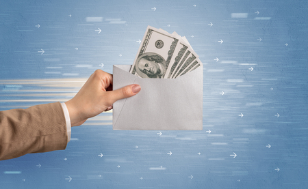 Female hand holding empty and full envelope with blue background and direction concept
の写真素材