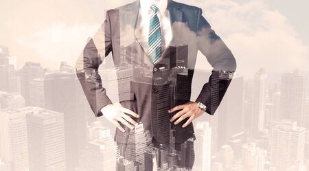 Handsome business man with overlay cityscape backgroundの写真素材