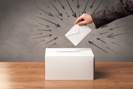 close up of a ballot box and casting vote on grungy backgroundの写真素材
