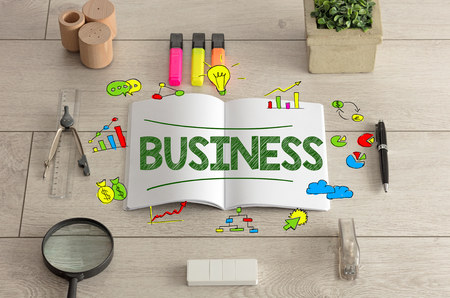 Notebook on the floor with instruments nearby and with colorful charts の写真素材