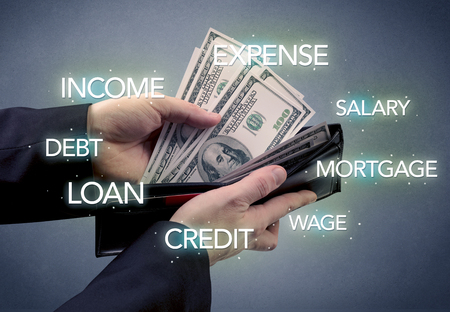 Businessman's hand takes out dollar from wallet with bank keywording wallpaper