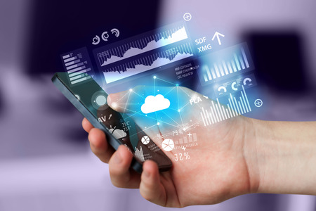 Hand using phone with cloud technology and linked information concept