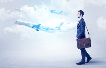 Businessman going somewhere with airplaneの写真素材
