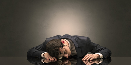 Businessman fell asleep at his workplaceの写真素材