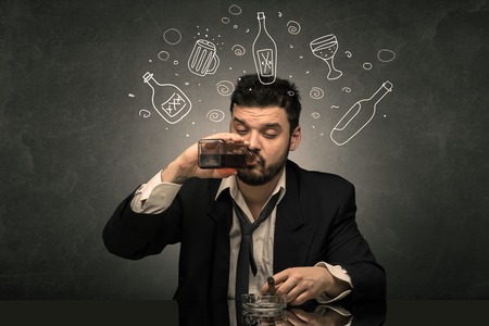 Drunk man with doodle alcohol bottles conceptの写真素材