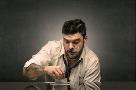 Drunk man at his office with copy spaceの写真素材