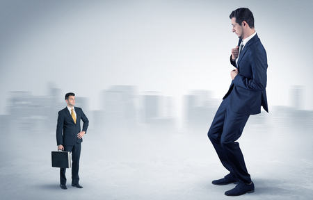 Giant businessman is  afraid of small executorの写真素材