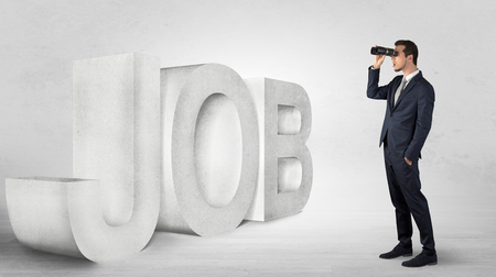 Businessman looking forward with binocularsの写真素材