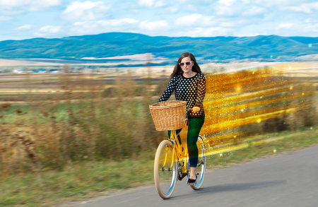 Young riding bicycle in natureの写真素材