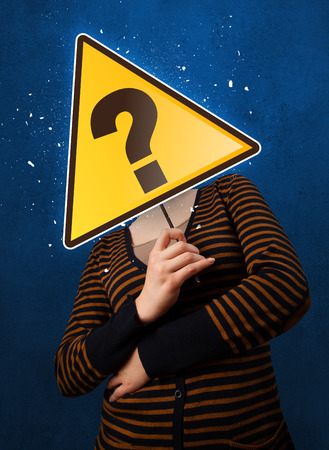 Woman holding question markの写真素材
