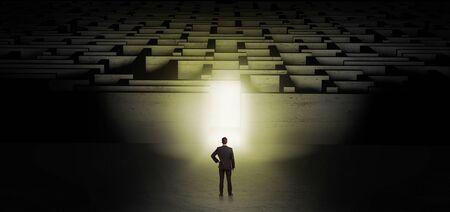 Businessman starting a dark labyrinth challengeの写真素材