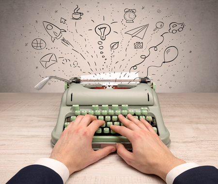 Typewriter with doodles, idea, message, plane, car balloon social media concept
の写真素材