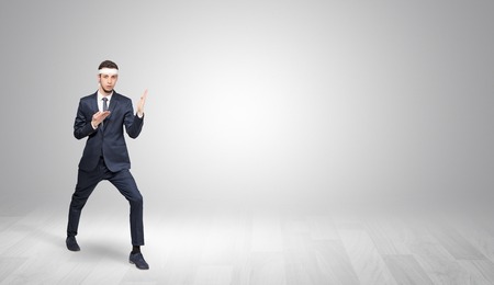 Businessman fighting in an empty spaceの写真素材