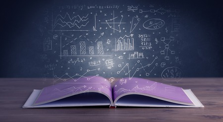 Hand-drawn financial plans and charts coming out of an open book の写真素材