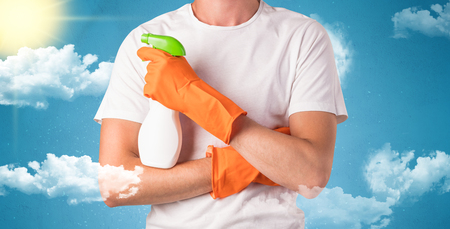 Sunny concept with housekeeper and orange glovesの写真素材