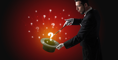 Magician conjure question signs from a cylinderの写真素材