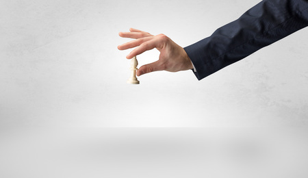 Big elegant hand taking his next step on chess game
の写真素材