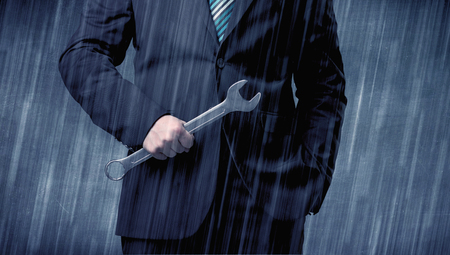 Employer standing with tool on his handの写真素材