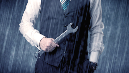 Employer standing with tool on his handの写真素材
