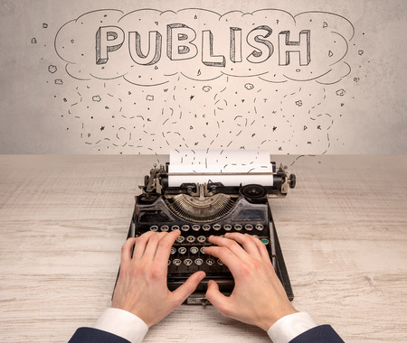 First person perspective hand and typewriter with cloud message conceptの写真素材