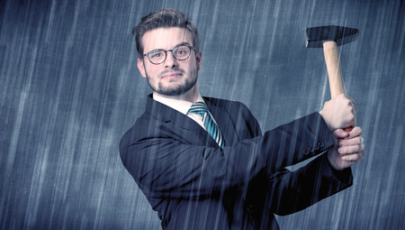Employer standing with tool on his handの写真素材