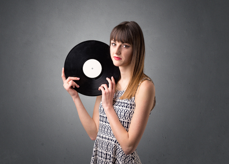 Lady holding vinyl recordの写真素材