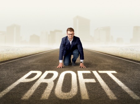 Businessman kneeling in ready positionの写真素材