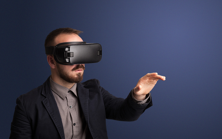 Businessman with virtual reality gogglesの写真素材