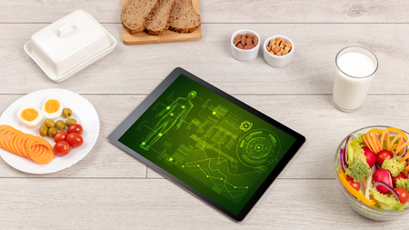 Healthy food composition with tabletの写真素材