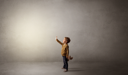 Little waggish kid in an empty roomの写真素材