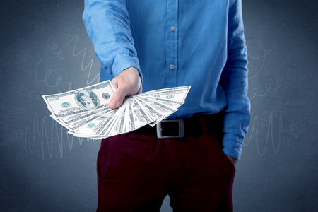 Businessman holding moneyの写真素材