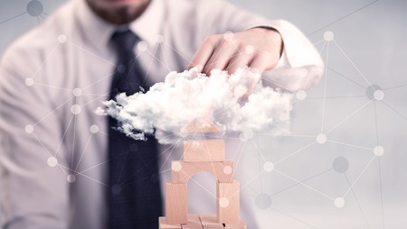 Businessman building a tower