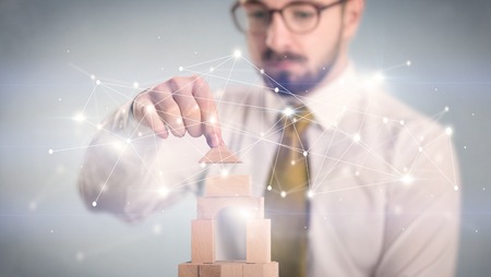 Businessman building a towerの写真素材