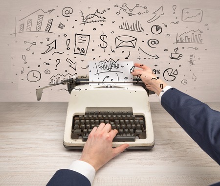 Typewriter with doodles, idea, message, plane, car balloon social media conceptの写真素材