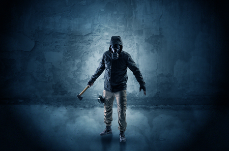 Peril man in front of a crumbly wallの写真素材