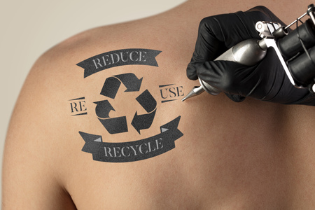 Tattooing recycle for a better environment concept on naked back