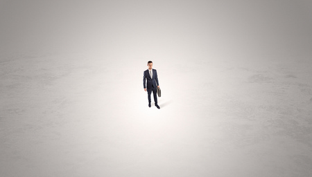 Businessman standing in the middle of an empty spaceの写真素材