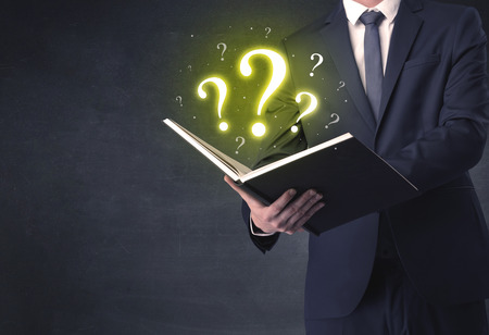 Businessman looking in a book.の写真素材